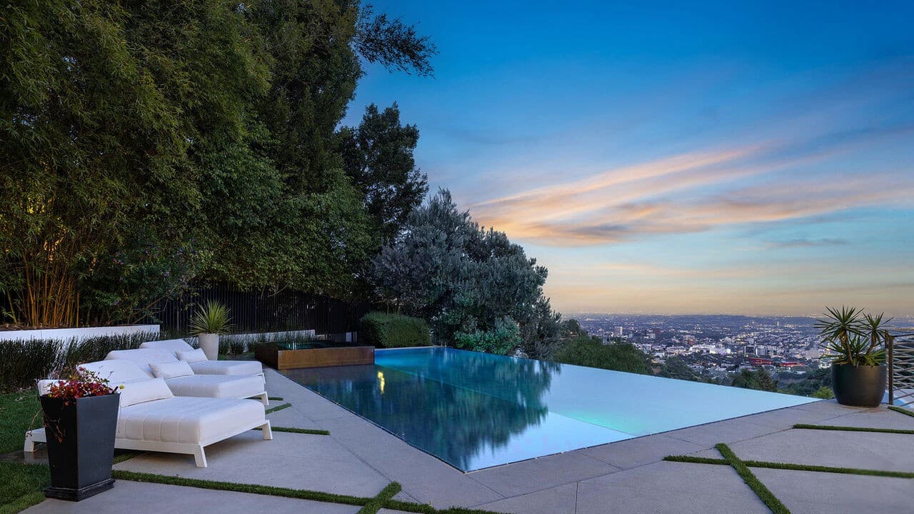Stunning infinity pool with panoramic Los Angeles city views at sunset