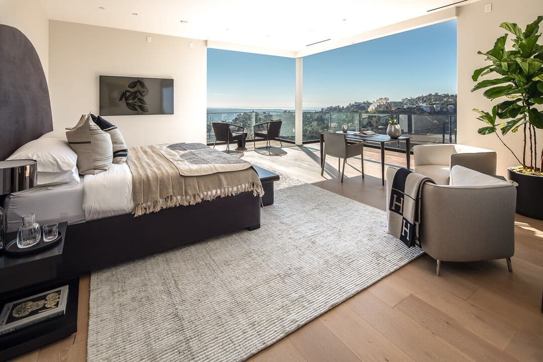 Modern bedroom with panoramic views and elegant furnishings